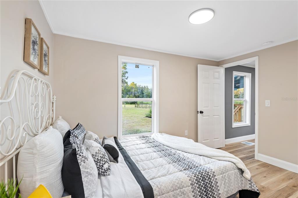 6455 West Cardinal Street Homosassa, FL 34446 - Photo 34 of 38 a bedroom with a bed and a window
