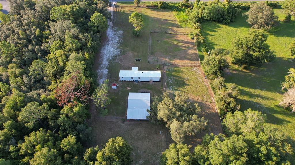 6455 West Cardinal Street Homosassa, FL 34446 - Photo 37 of 38 a aerial view of a house with a yard and lake view