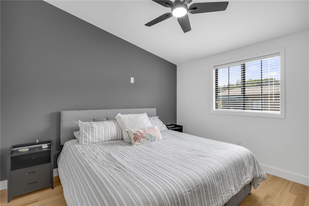1230 Melton Road, Unit 30 West Union, SC 29696 - Photo 16 of 42 Hardwood floors and a ceiling fan create a comfortable atmosphere in this well-appointed bedroom.