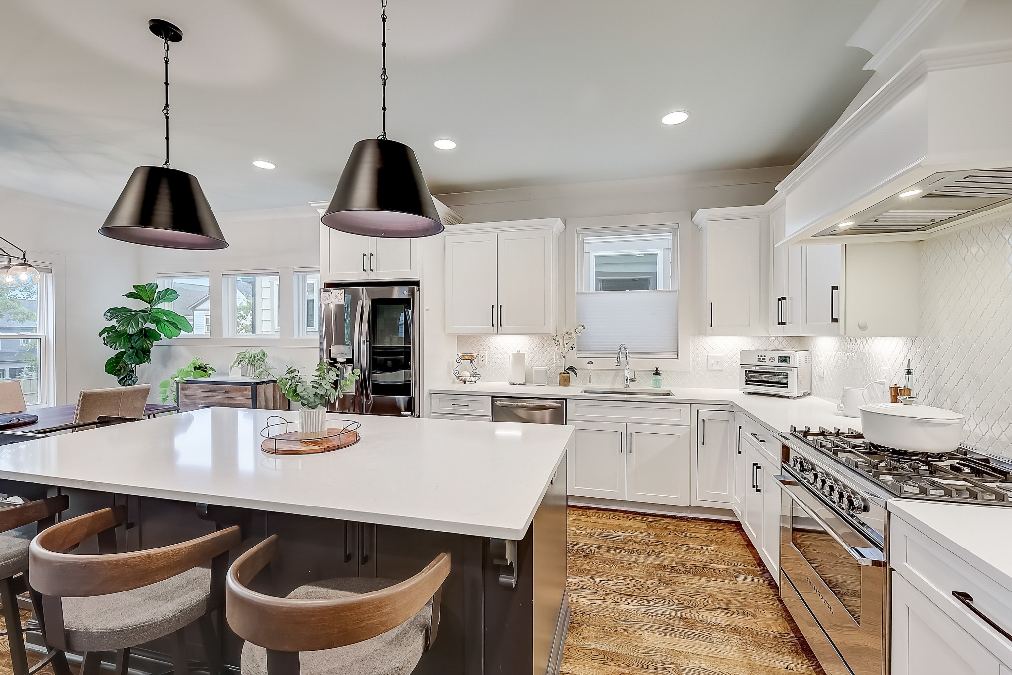 2010 Sheridan Road Nashville, TN 37206 - Photo 22 of 62 a kitchen with stainless steel appliances a stove a sink a kitchen island and chairs