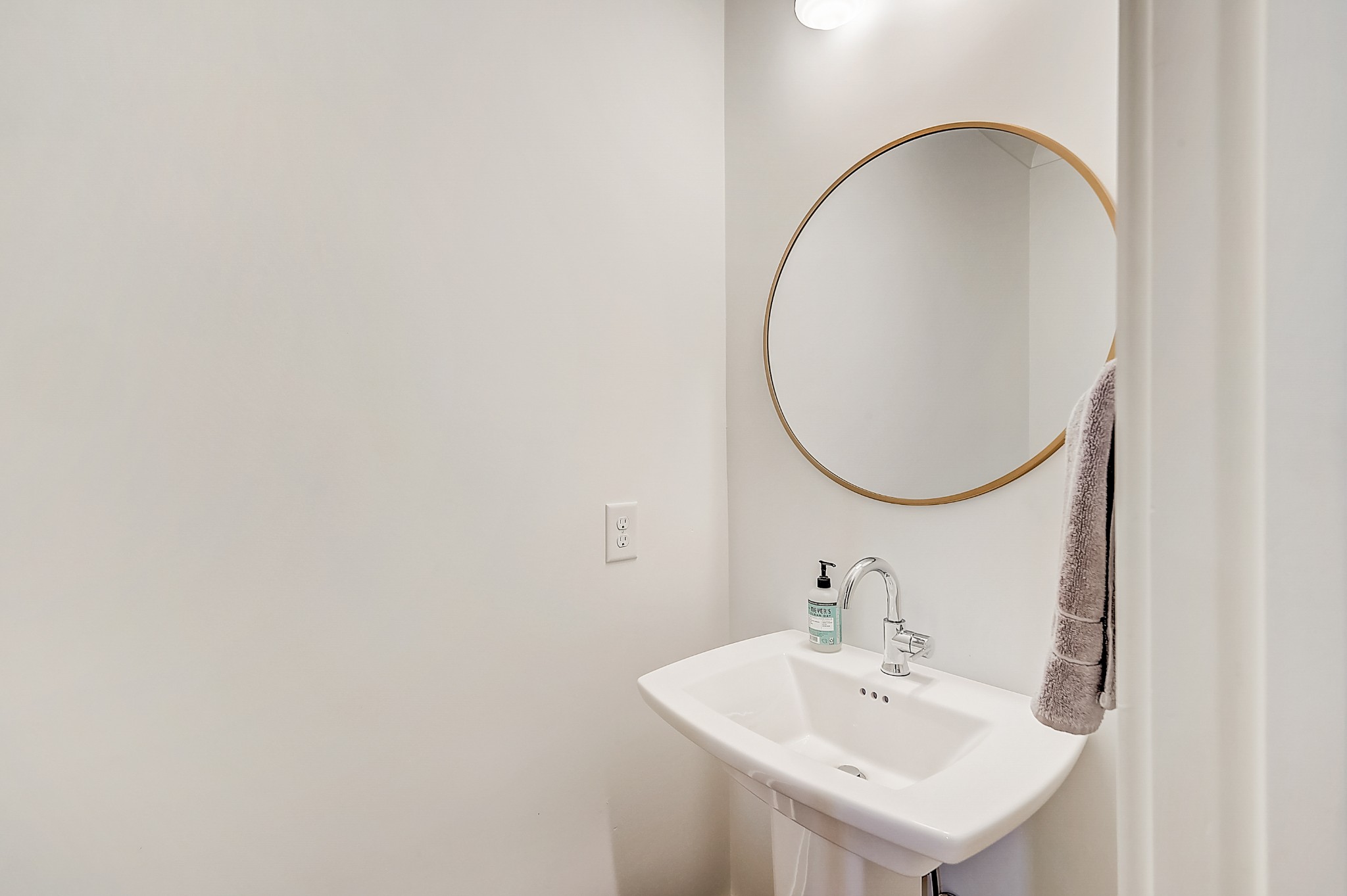 2010 Sheridan Road Nashville, TN 37206 - Photo 29 of 62 a bathroom with a sink and a mirror