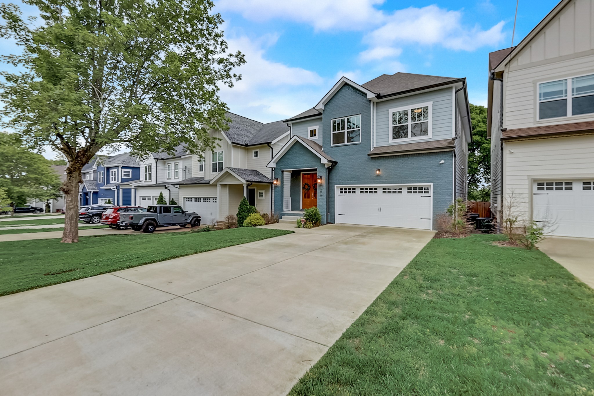 2010 Sheridan Road Nashville, TN 37206 - Photo 3 of 62 a front view of a house with a yard and trees
