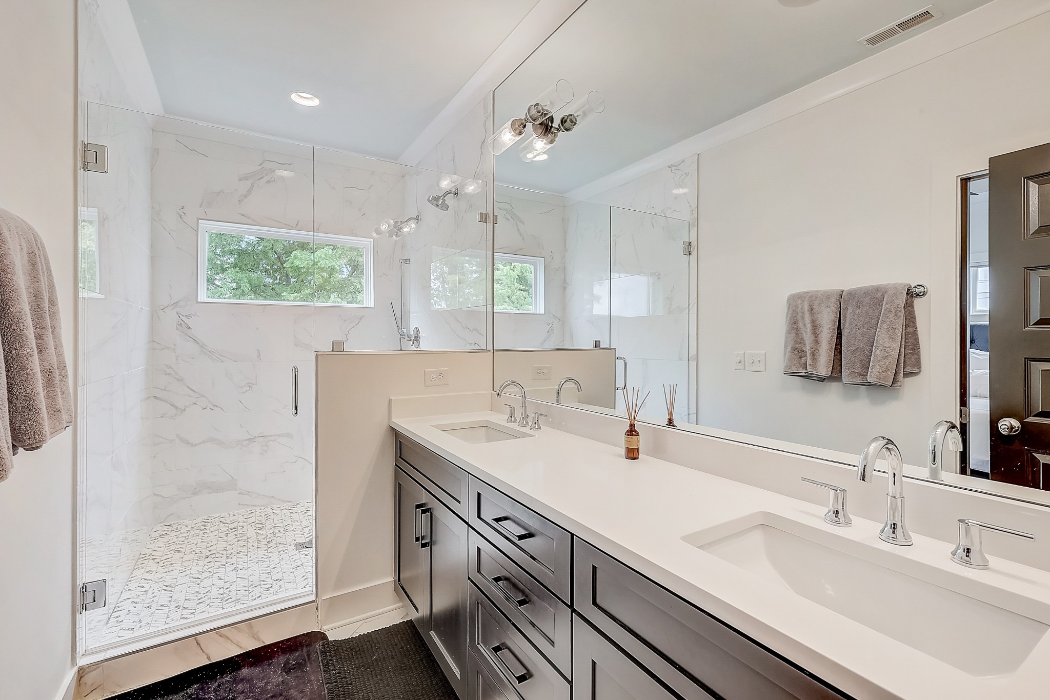 2010 Sheridan Road Nashville, TN 37206 - Photo 35 of 62 a bathroom with a double vanity sink mirror and shower