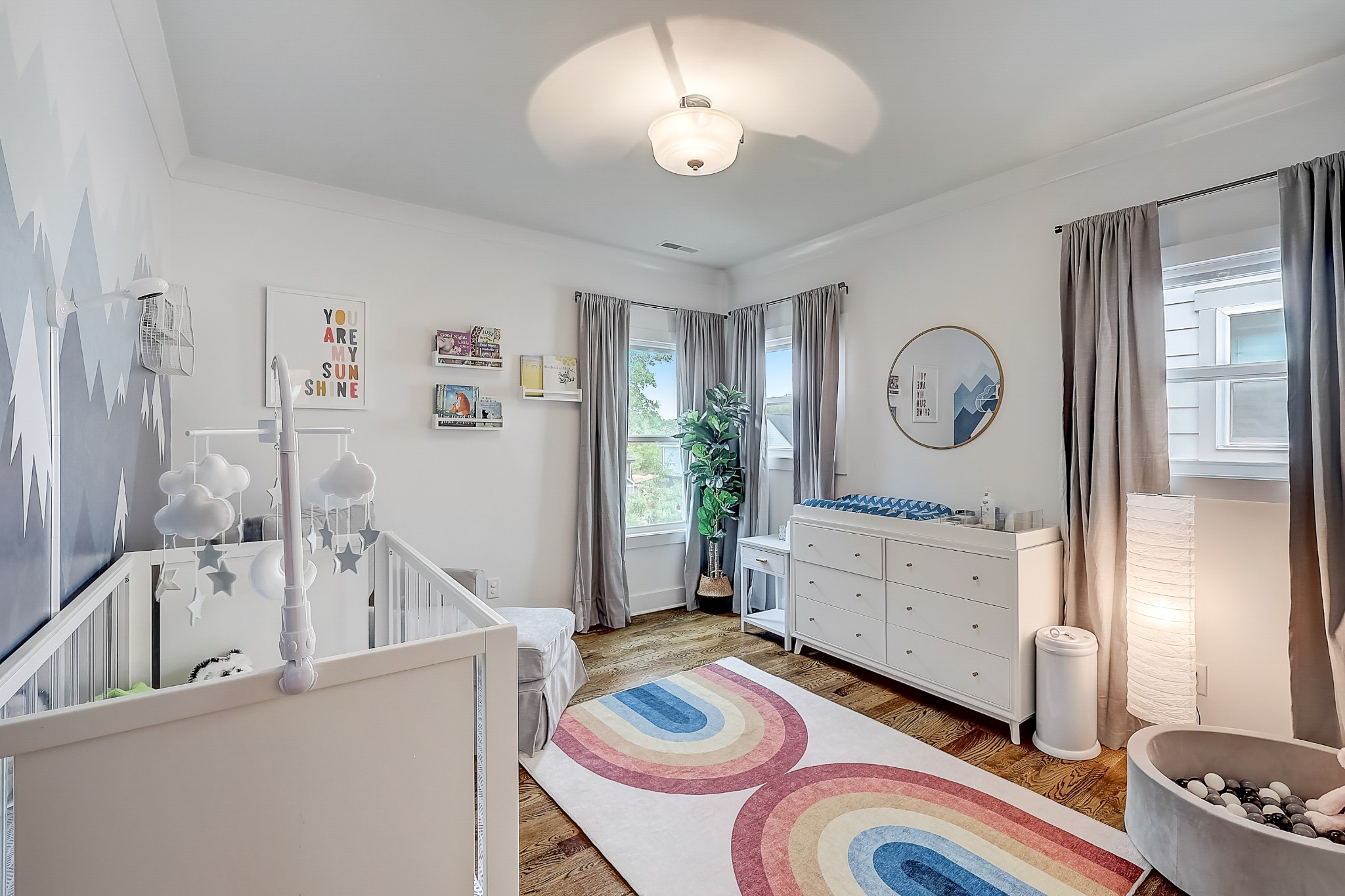 2010 Sheridan Road Nashville, TN 37206 - Photo 41 of 62 a bedroom with a bed and a chandelier