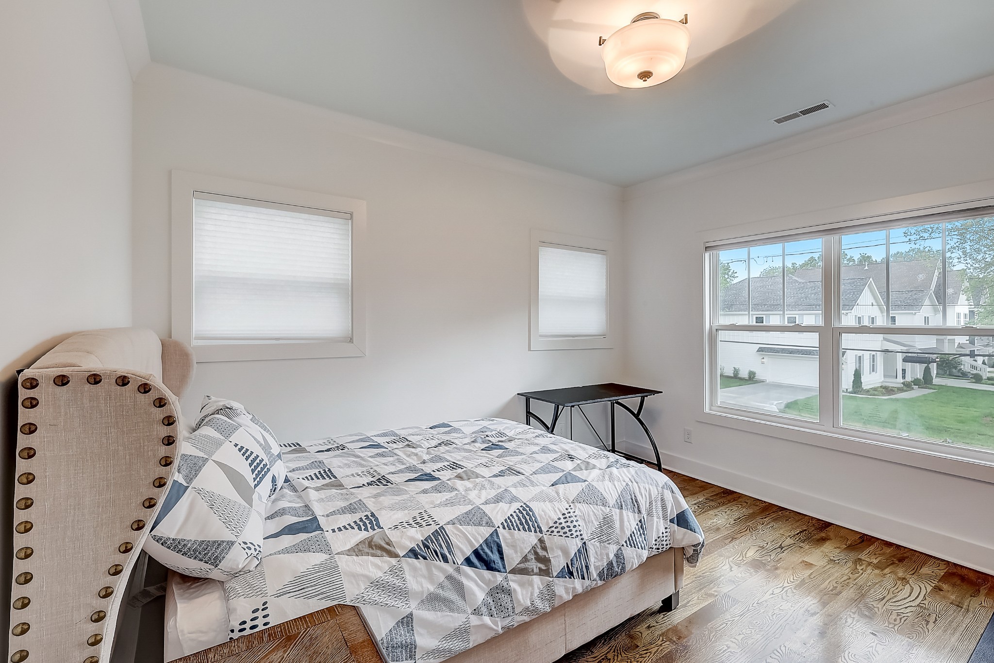 2010 Sheridan Road Nashville, TN 37206 - Photo 46 of 62 a bedroom with a bed and a large window