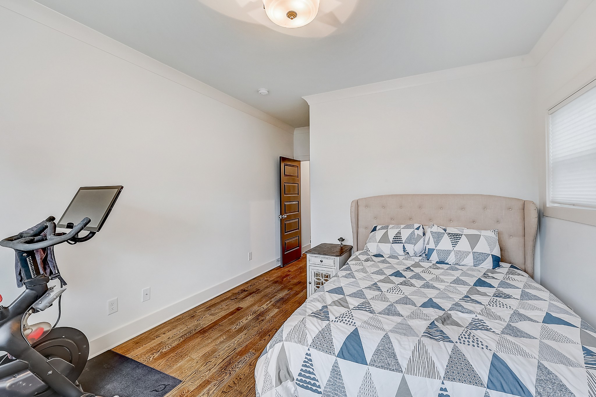 2010 Sheridan Road Nashville, TN 37206 - Photo 48 of 62 a bedroom with a bed and wooden floor