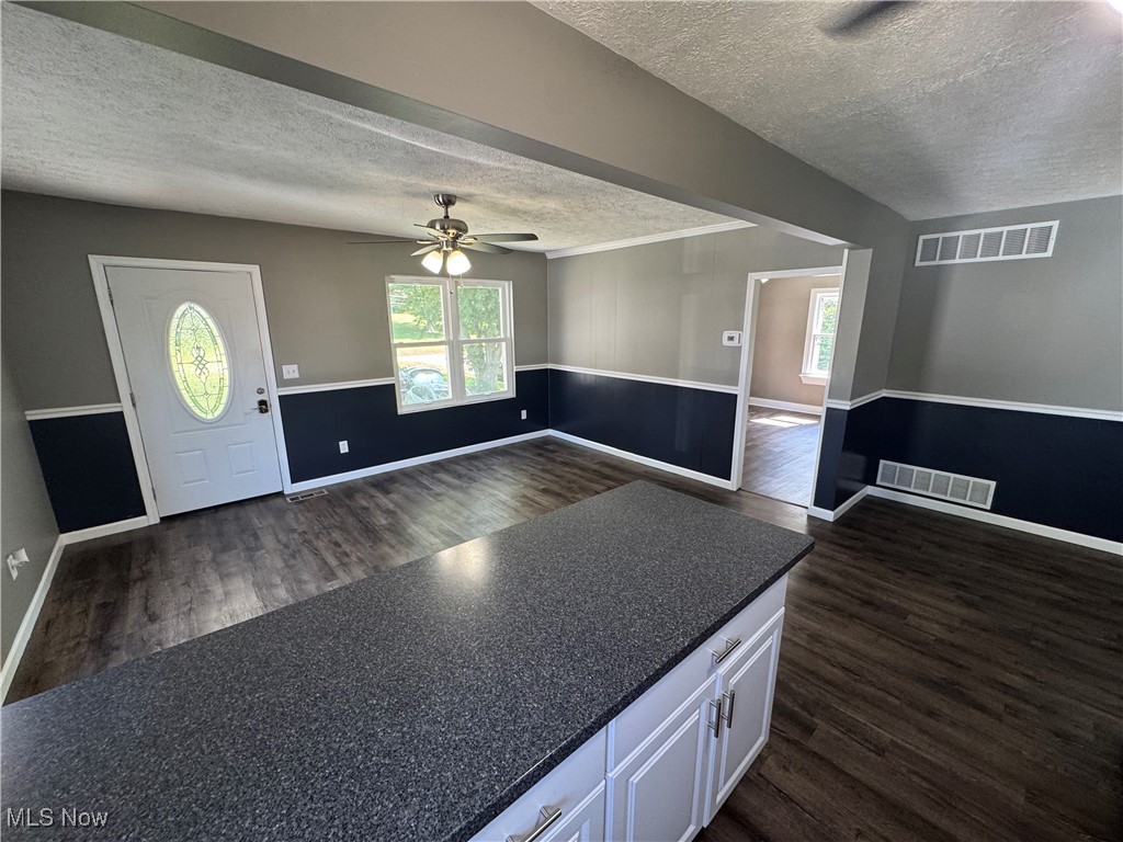 2660 Ridge Road Zanesville, OH 43701 - Photo 12 of 20 Entrance foyer with a textured ceiling, dark wood-style floors, and a ceiling fan