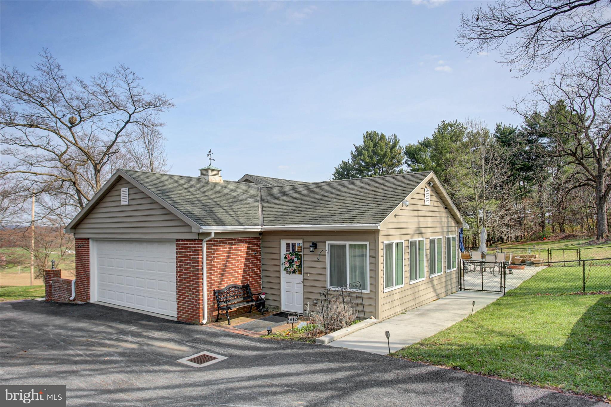 6612 Moulstown Road Hanover, PA 17331 - Photo 2 of 84 a view of a house with a yard and table and chairs under an umbrella