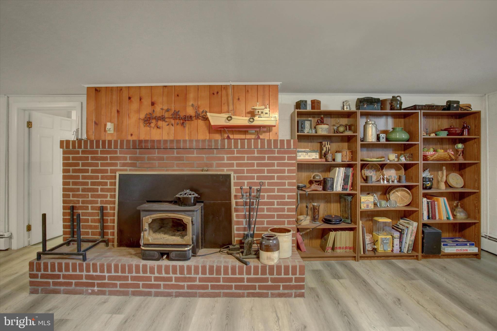 6612 Moulstown Road Hanover, PA 17331 - Photo 41 of 84 a living room with furniture a fireplace and a book shelf