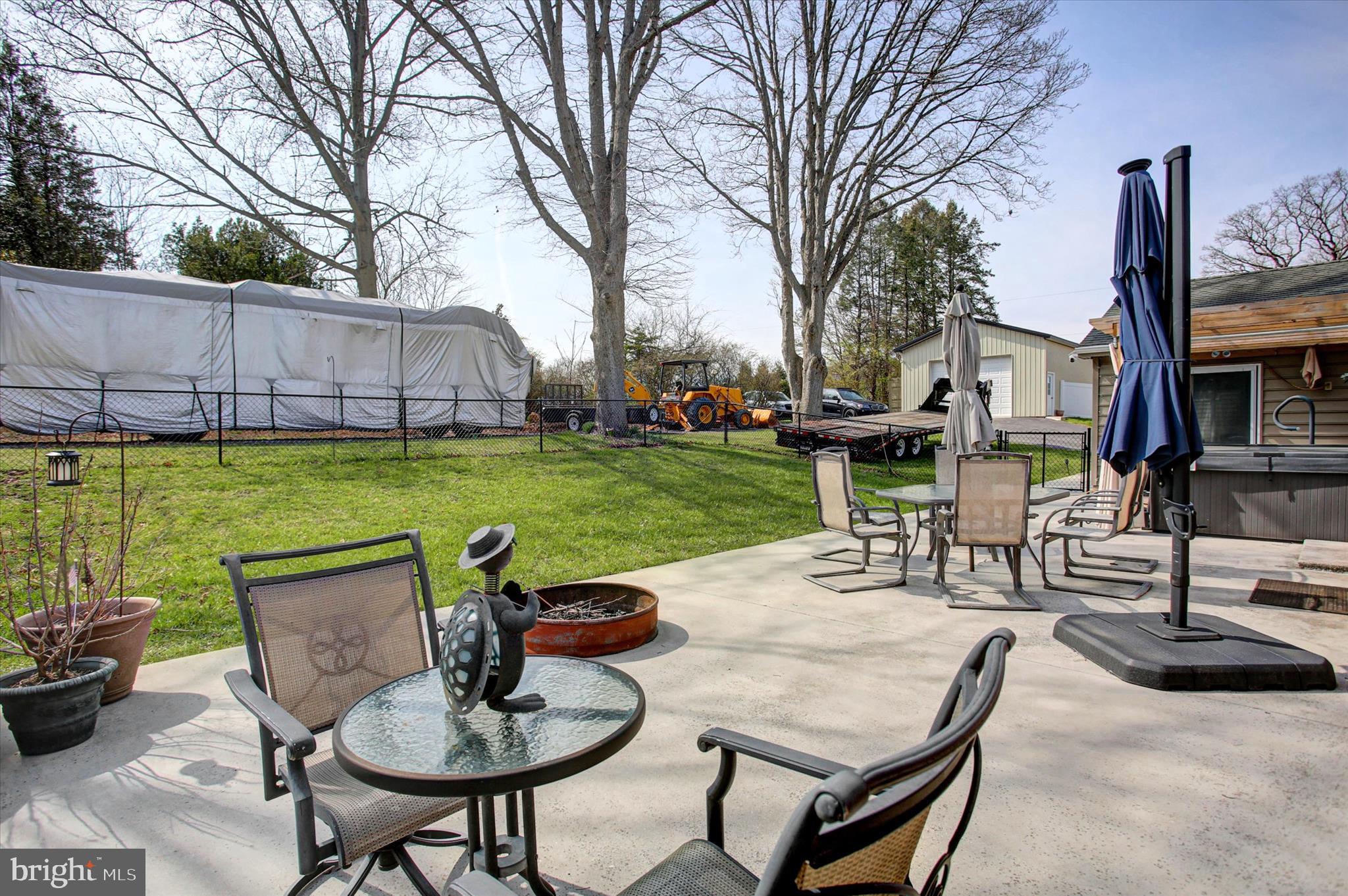 6612 Moulstown Road Hanover, PA 17331 - Photo 58 of 84 a view of a patio with table and chairs potted plants and a large tree