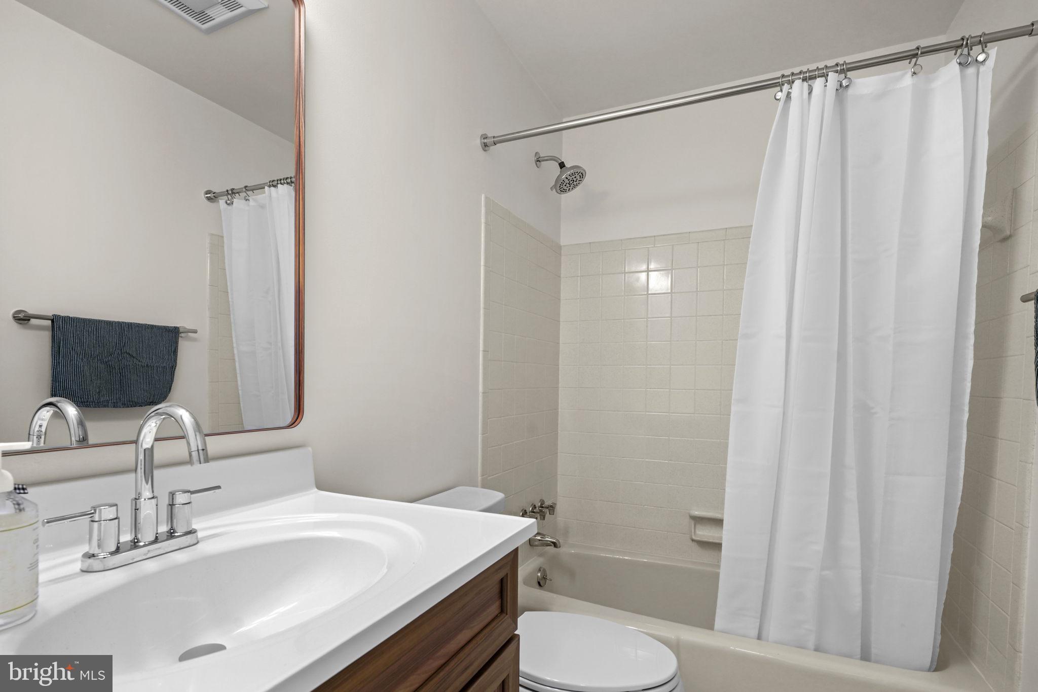 1420 Gilbert Road Arnold, MD 21012 - Photo 17 of 23 a bathroom with a sink toilet and shower