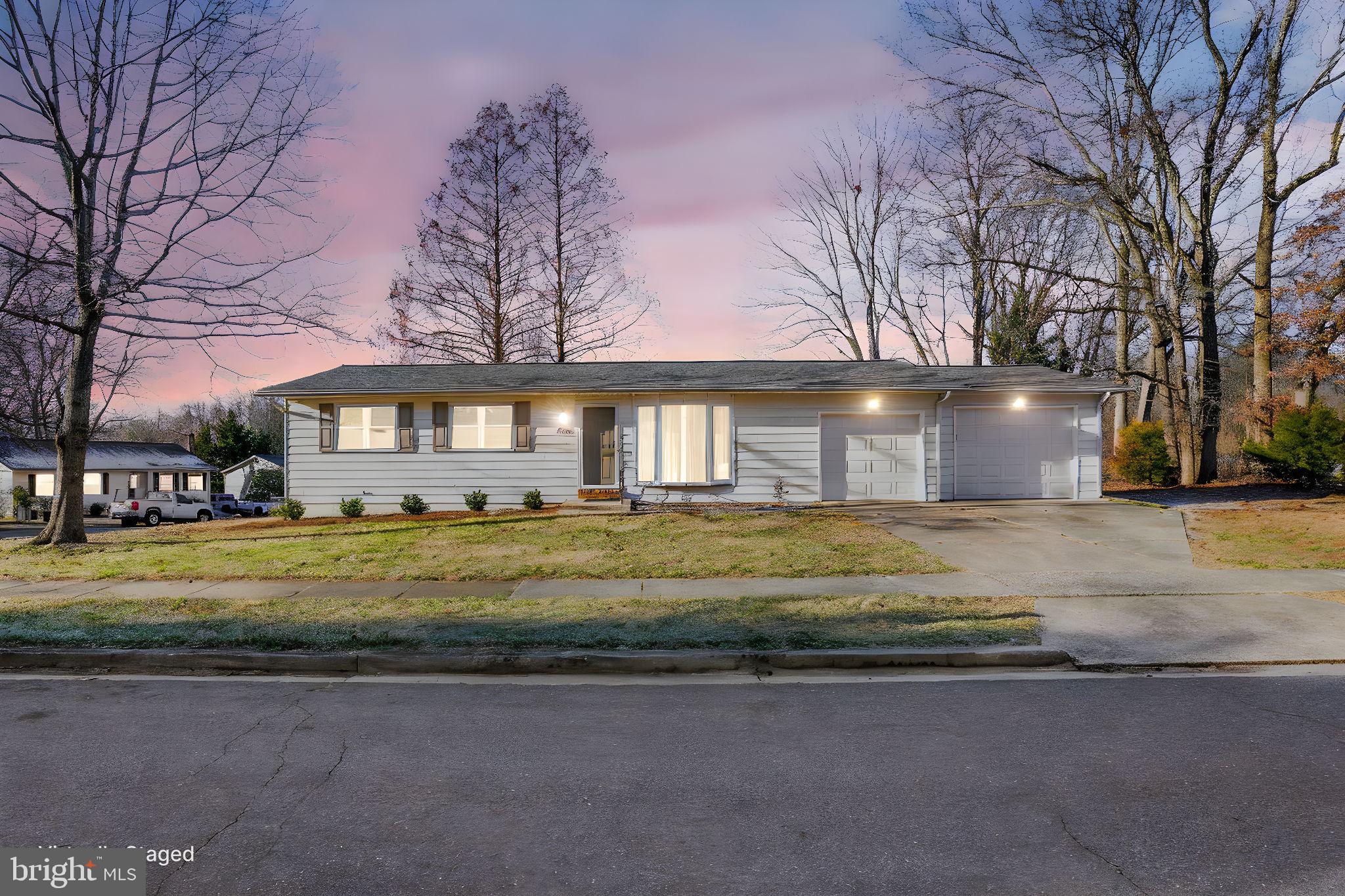 1420 Gilbert Road Arnold, MD 21012 - Photo 22 of 23 a front view of a house with a garden and trees
