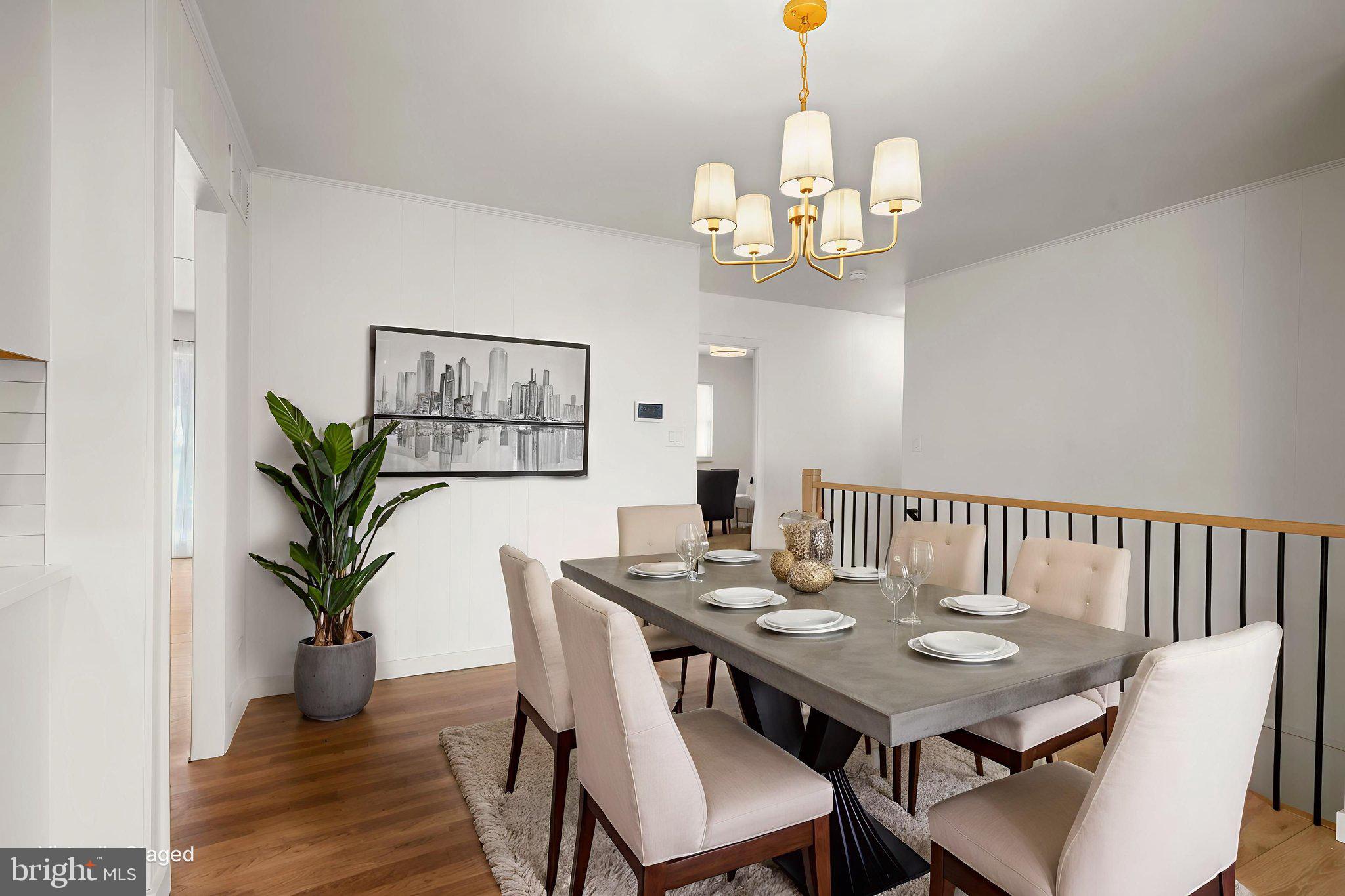 1420 Gilbert Road Arnold, MD 21012 - Photo 5 of 23 a view of a dining room with furniture wooden floor and chandelier