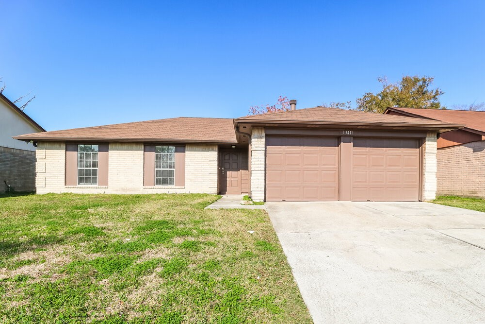 13411 Reads Court Houston, TX 77015 - Photo 1 of 16 a front view of a house with a yard