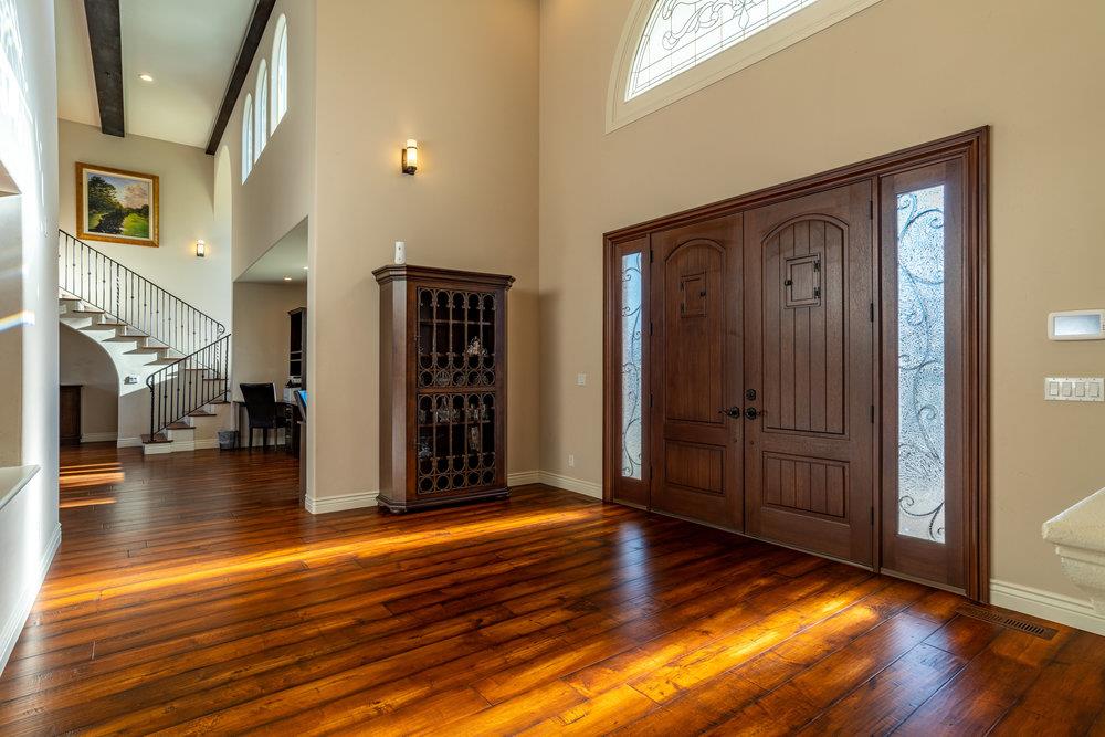 2985 Day Road Gilroy, CA 95020 - Photo 15 of 100 a view of a hallway with wooden floor and a bathroom