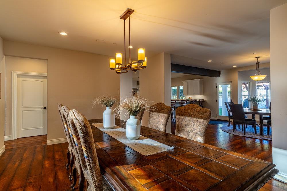 2985 Day Road Gilroy, CA 95020 - Photo 25 of 100 a view of a dining room and livingroom with furniture wooden floor a chandelier