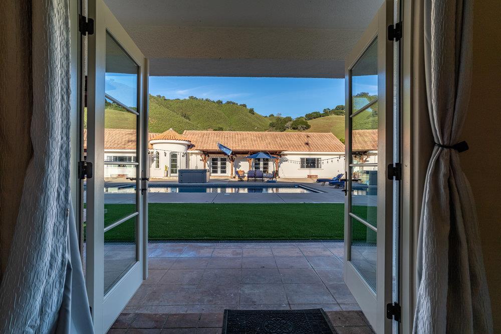 2985 Day Road Gilroy, CA 95020 - Photo 49 of 100 a view of a porch with a floor to ceiling window and an outdoor kitchen