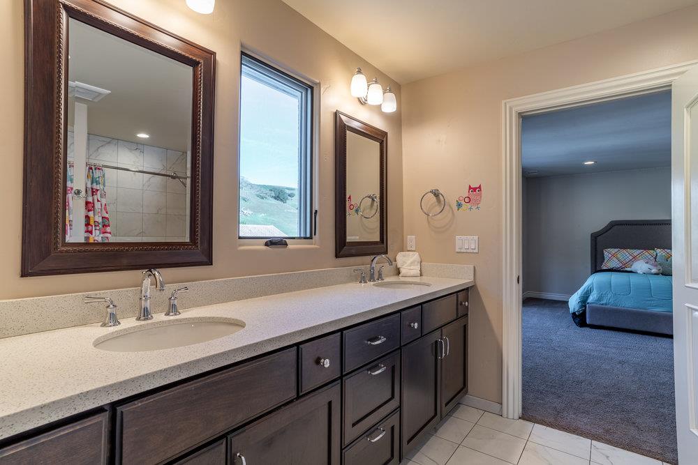 2985 Day Road Gilroy, CA 95020 - Photo 64 of 100 a en suite bathroom with a double vanity sink and a mirror