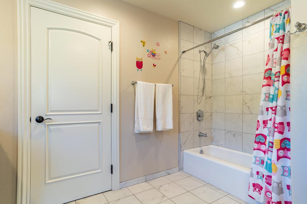 2985 Day Road Gilroy, CA 95020 - Photo 65 of 100 a bathroom with a bathtub and a shower