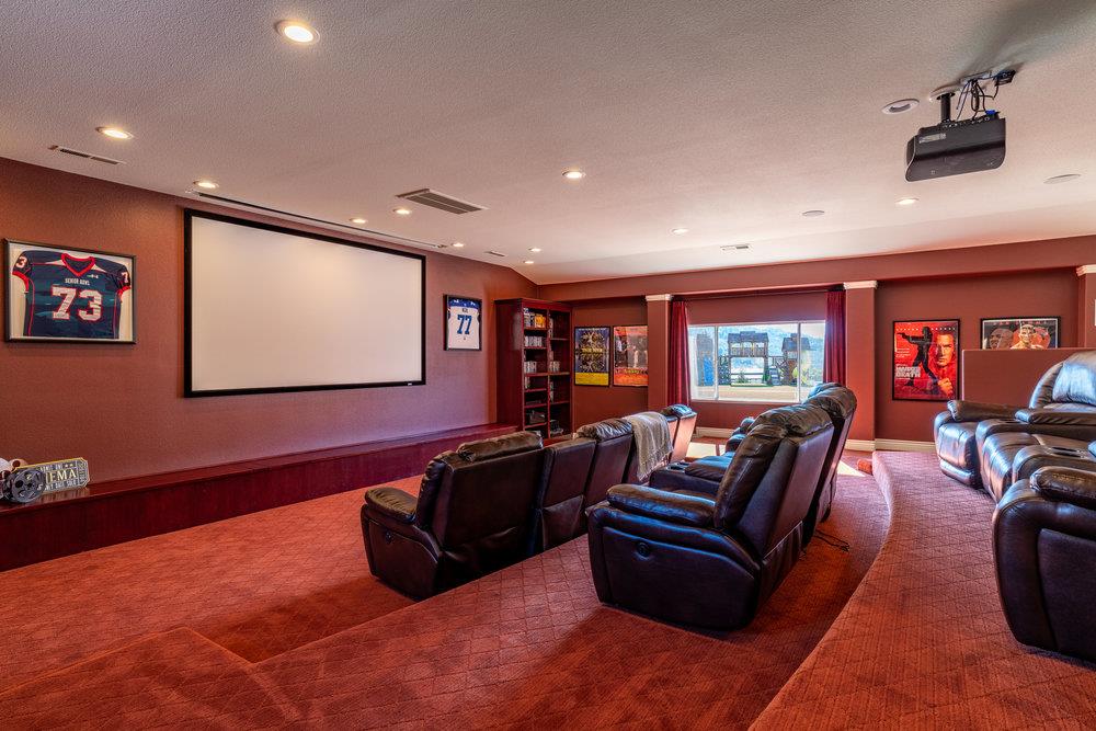 2985 Day Road Gilroy, CA 95020 - Photo 87 of 100 a living room with furniture a projector and a flat screen tv