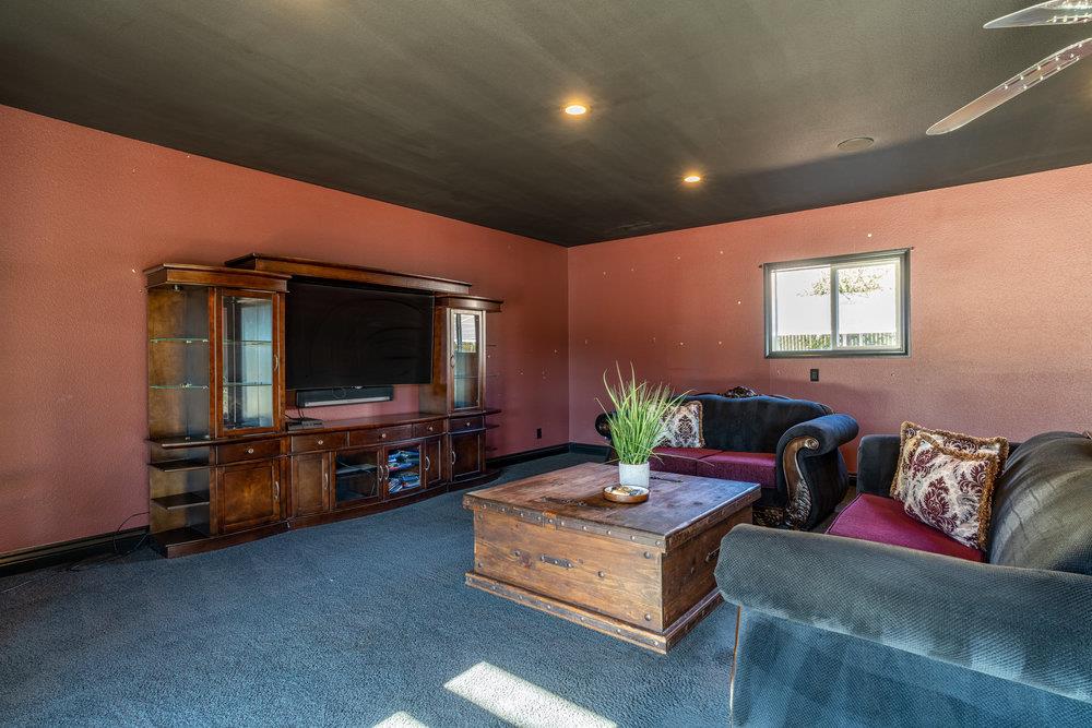 2985 Day Road Gilroy, CA 95020 - Photo 89 of 100 a living room with furniture and a flat screen tv