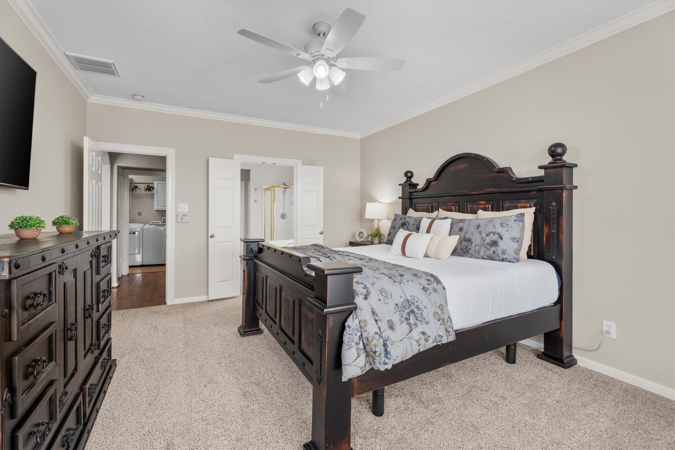 6323 Stone Trail Lane Spring, TX 77379 - Photo 18 of 43 a bedroom with a bed and a chandelier