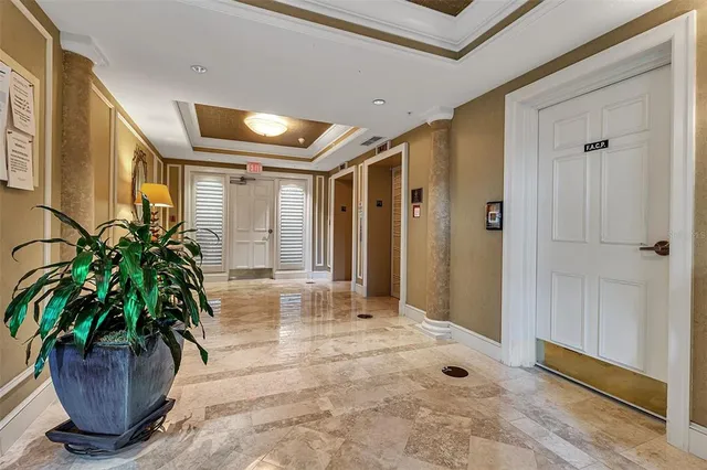a lobby with furniture and wooden floor