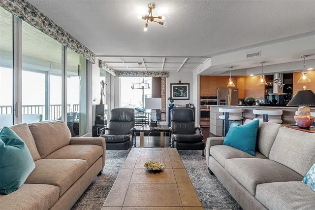 a bedroom with two beds and windows