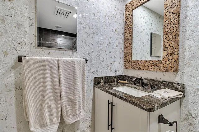 a view of a backyard with large trees