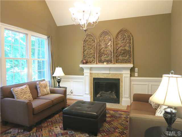 1627 Weatherford Circle Raleigh, NC 27604 - Photo 14 of 25 The vaulted Keeping/Family Rm w/gas log FP & glass door to Screened Porch is off the Kitchen.