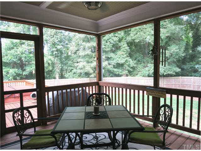 1627 Weatherford Circle Raleigh, NC 27604 - Photo 22 of 25 The lg Screened Porch w/bead board ceiling & CF steps out to the Deck and down to the backyard.