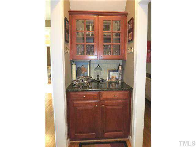 1627 Weatherford Circle Raleigh, NC 27604 - Photo 7 of 25 Between the formal Dining Rm, Living Rm & Kitchen is the Butlers Pantry w/cherry cabinets, glass doors & granite ctr.