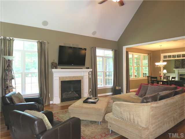 1627 Weatherford Circle Raleigh, NC 27604 - Photo 8 of 25 The spacious 2-story tall Living Rm offers a gas log FP flanked by windows, CF & surround sound.