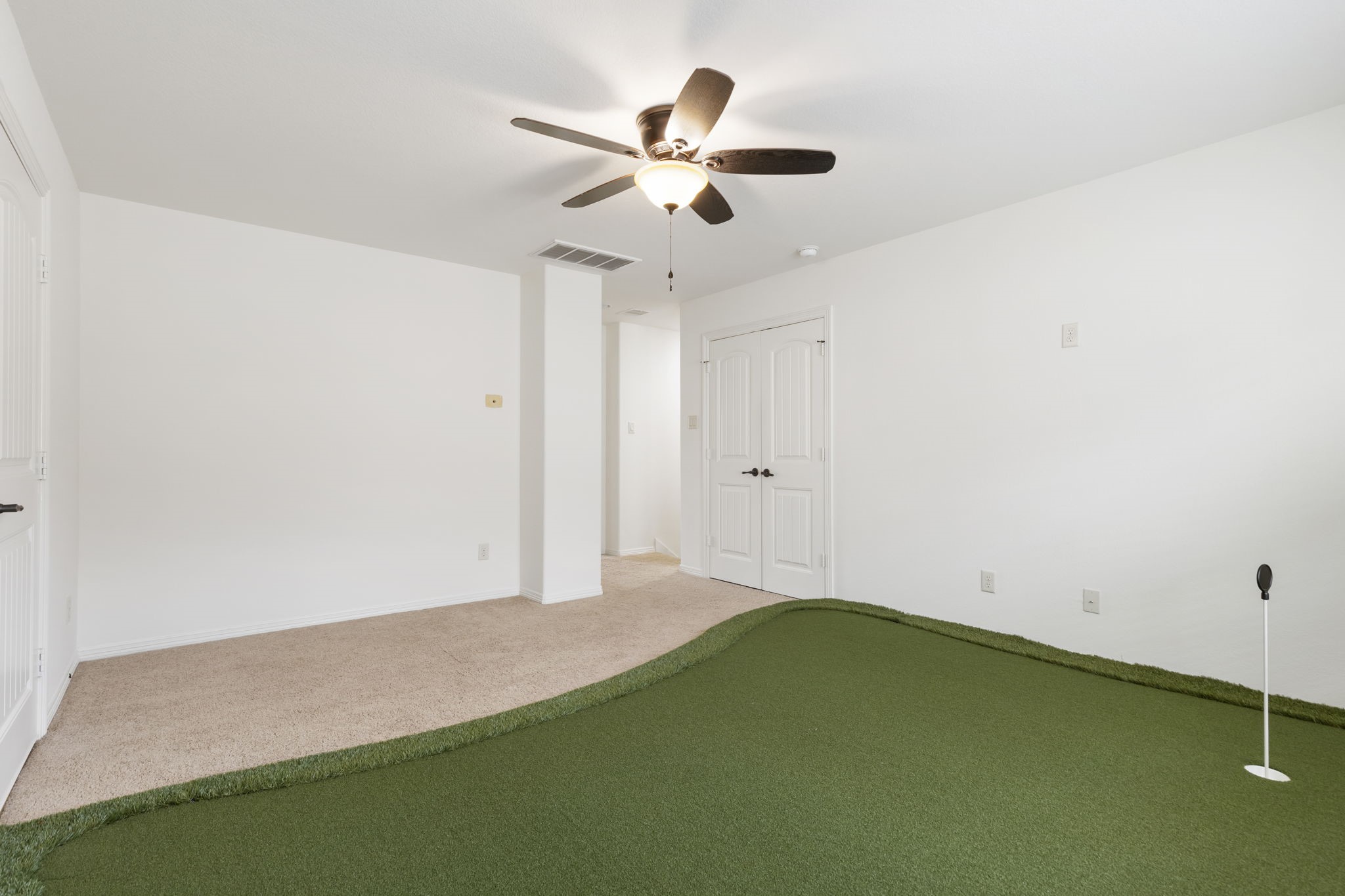 23911 Augusta Falls Lane Spring, TX 77389 - Photo 31 of 40 a view of a room with a ceiling fan and a hardwood floor