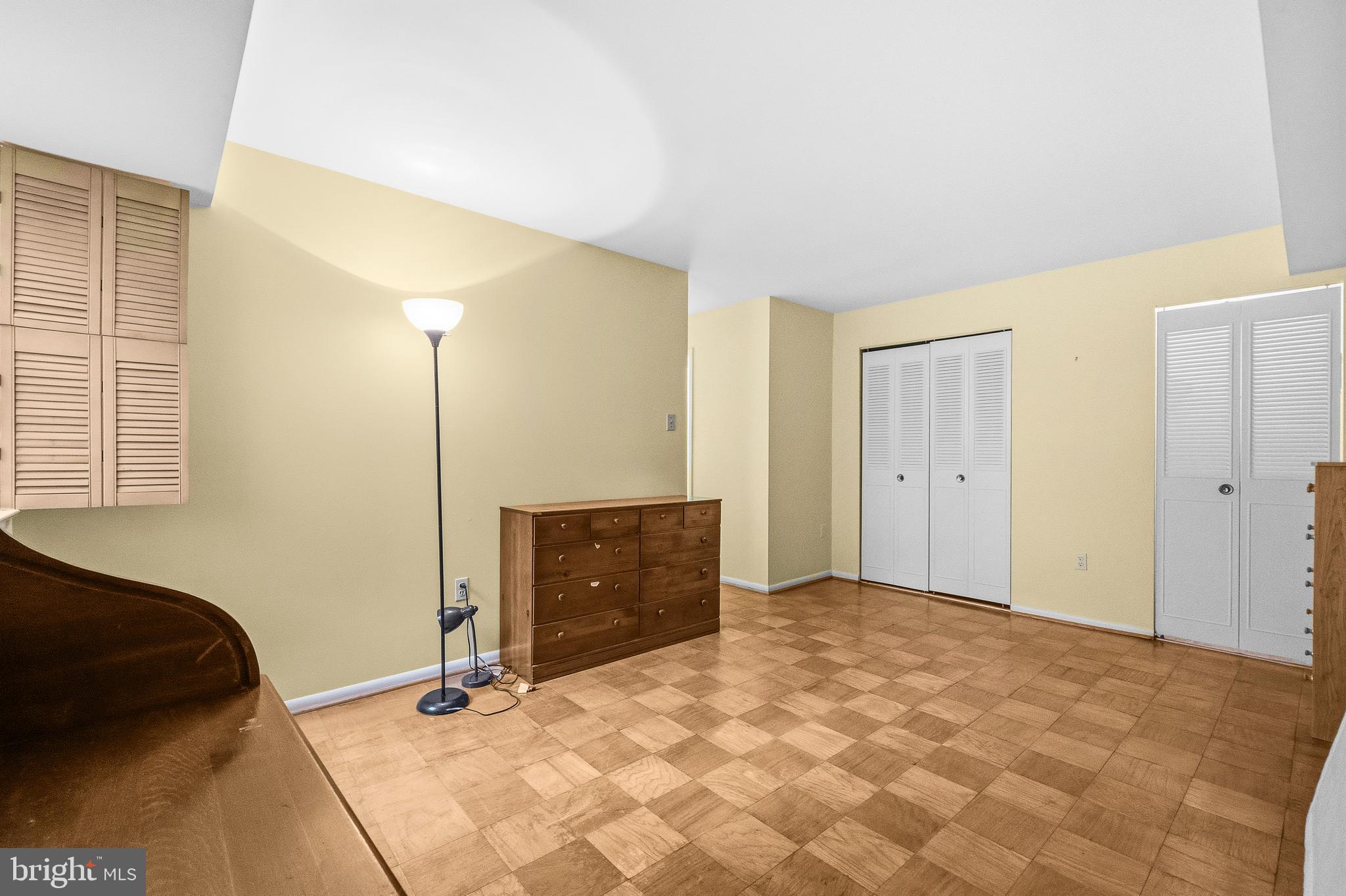 2305 Greenery Lane, Unit T23 Silver Spring, MD 20906 - Photo 23 of 40 a bedroom with a bed and a closet