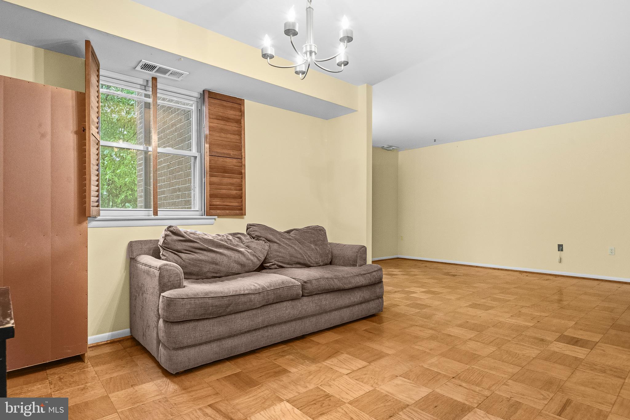 2305 Greenery Lane, Unit T23 Silver Spring, MD 20906 - Photo 10 of 40 a living room with furniture and a window