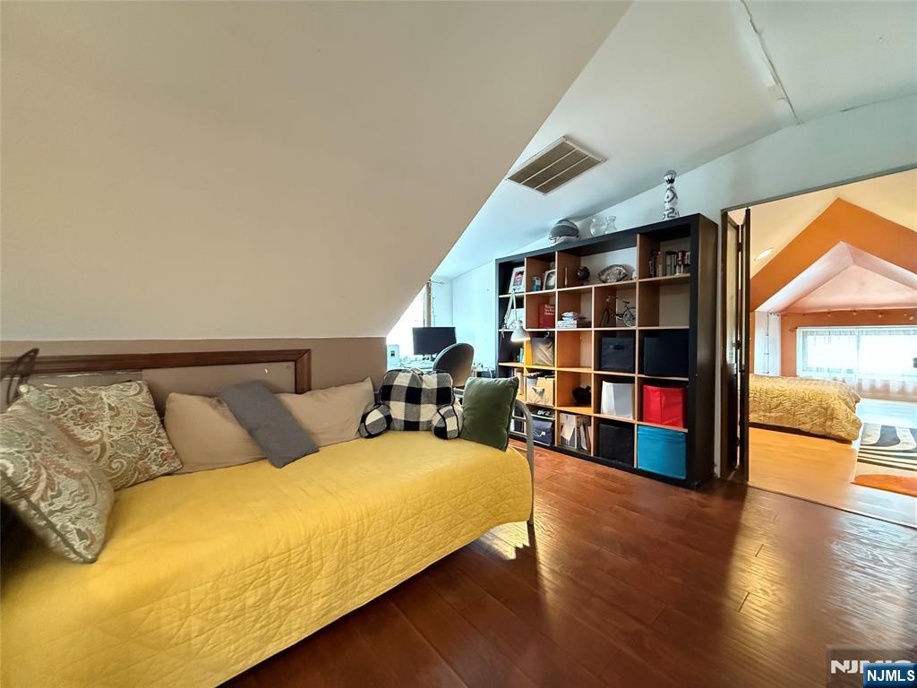 799 2nd Street Secaucus, NJ 07094 - Photo 20 of 48 a living room with furniture window and book shelf