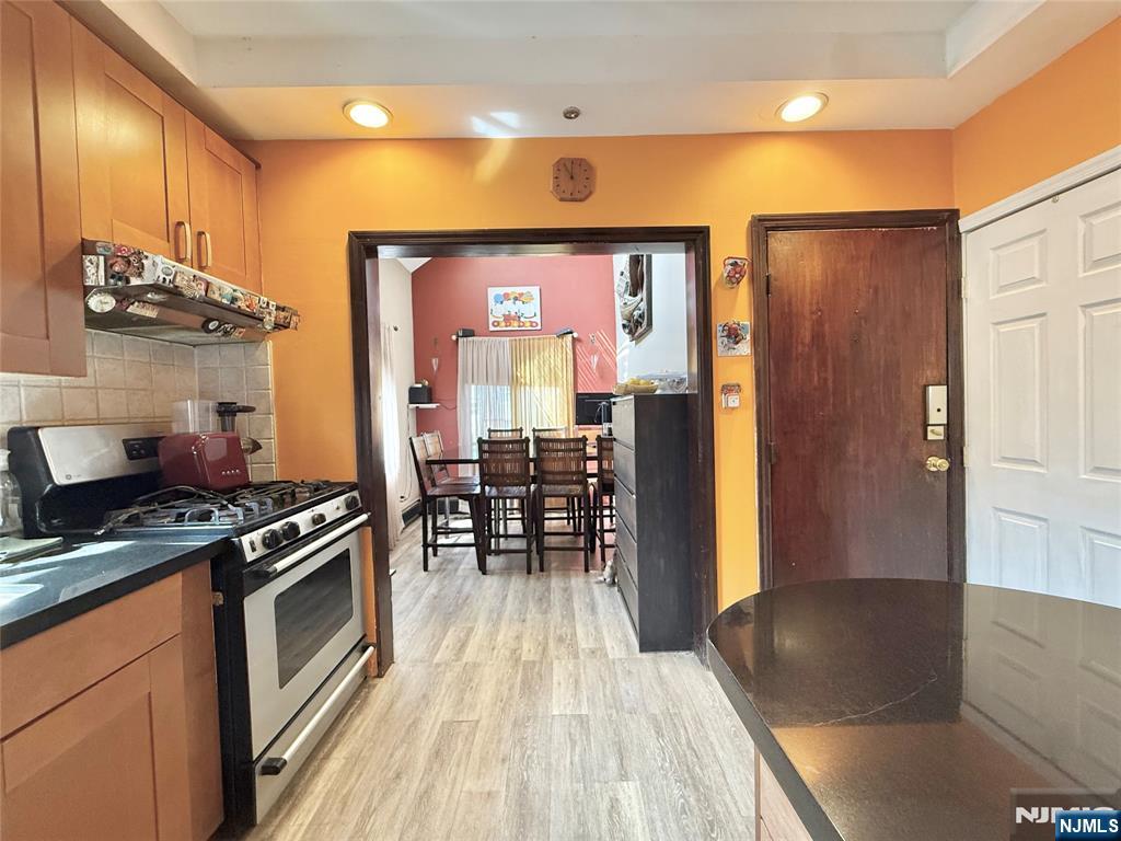 799 2nd Street Secaucus, NJ 07094 - Photo 30 of 48 a kitchen with granite countertop a stove and cabinets