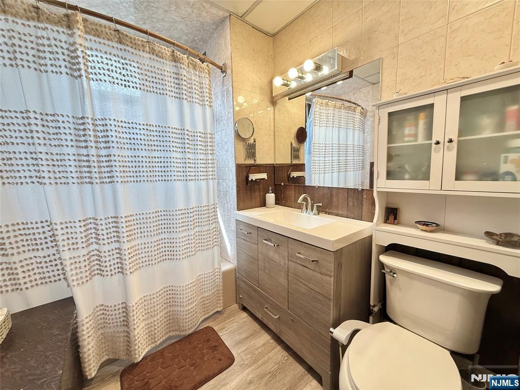 799 2nd Street Secaucus, NJ 07094 - Photo 32 of 48 a bathroom with a sink toilet vanity and shower