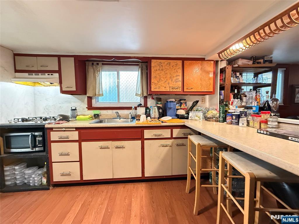 799 2nd Street Secaucus, NJ 07094 - Photo 35 of 48 a kitchen with stainless steel appliances granite countertop a sink and cabinets