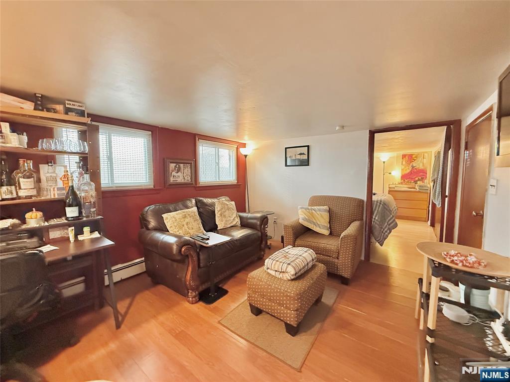 799 2nd Street Secaucus, NJ 07094 - Photo 36 of 48 a living room with furniture fireplace and a window