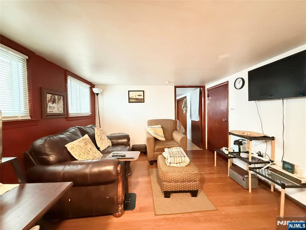 799 2nd Street Secaucus, NJ 07094 - Photo 38 of 48 a living room with furniture and a flat screen tv