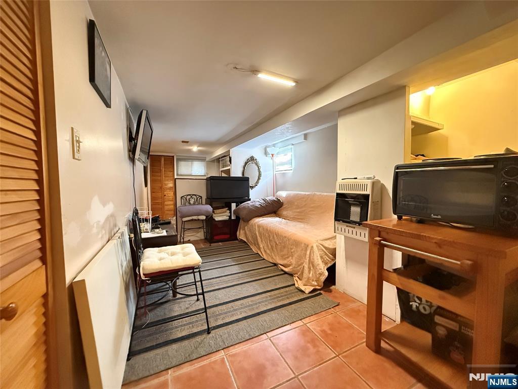 799 2nd Street Secaucus, NJ 07094 - Photo 42 of 48 a living room with furniture and a flat screen tv