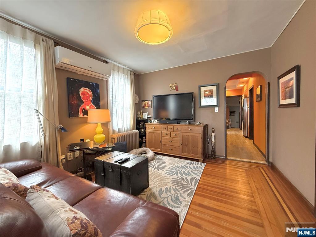 799 2nd Street Secaucus, NJ 07094 - Photo 9 of 48 a living room with furniture and a flat screen tv