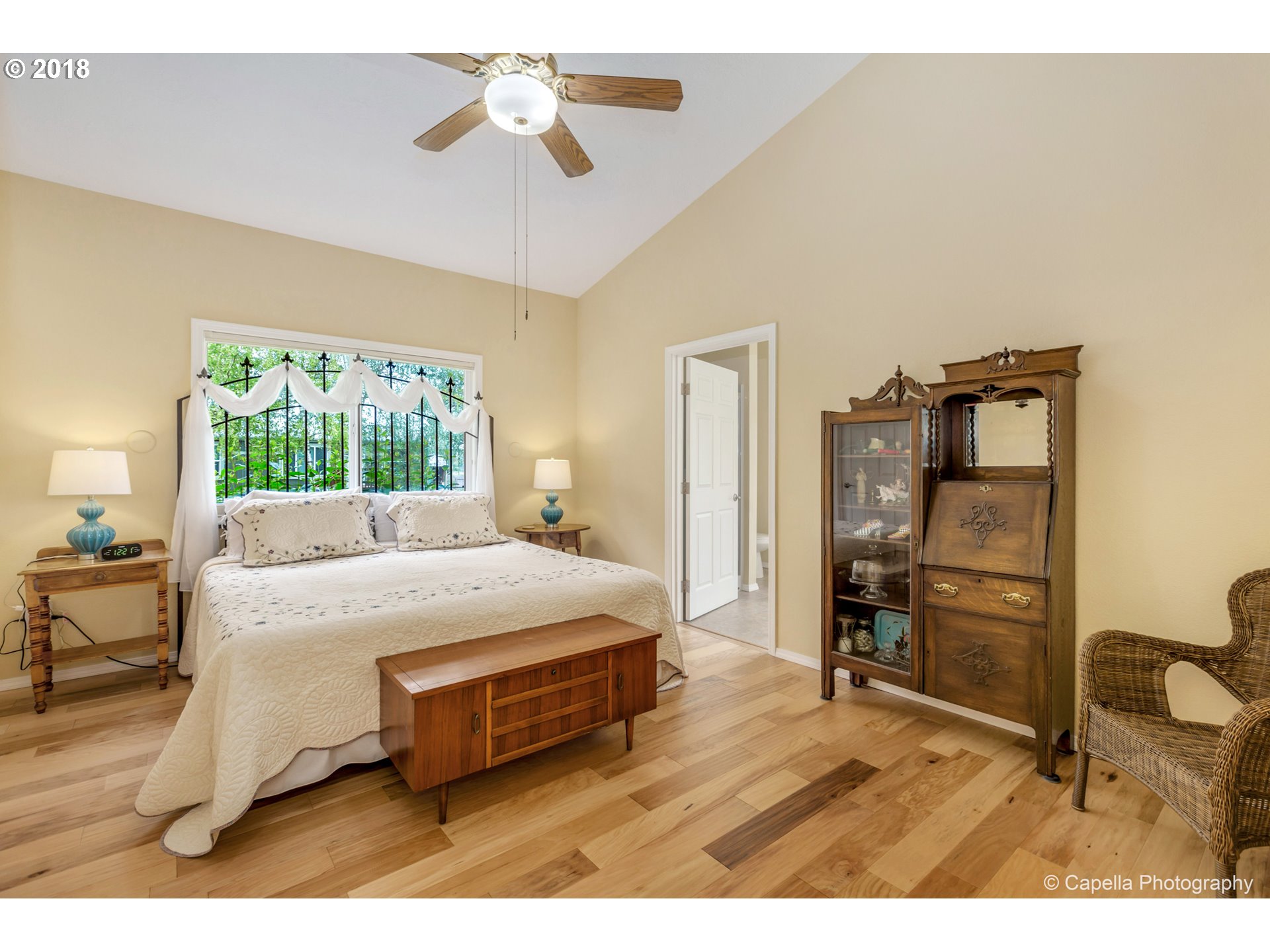 11675 Hazelgreen Road Northeast Silverton, OR 97381 - Photo 14 of 32 a bedroom with a bed and furniture