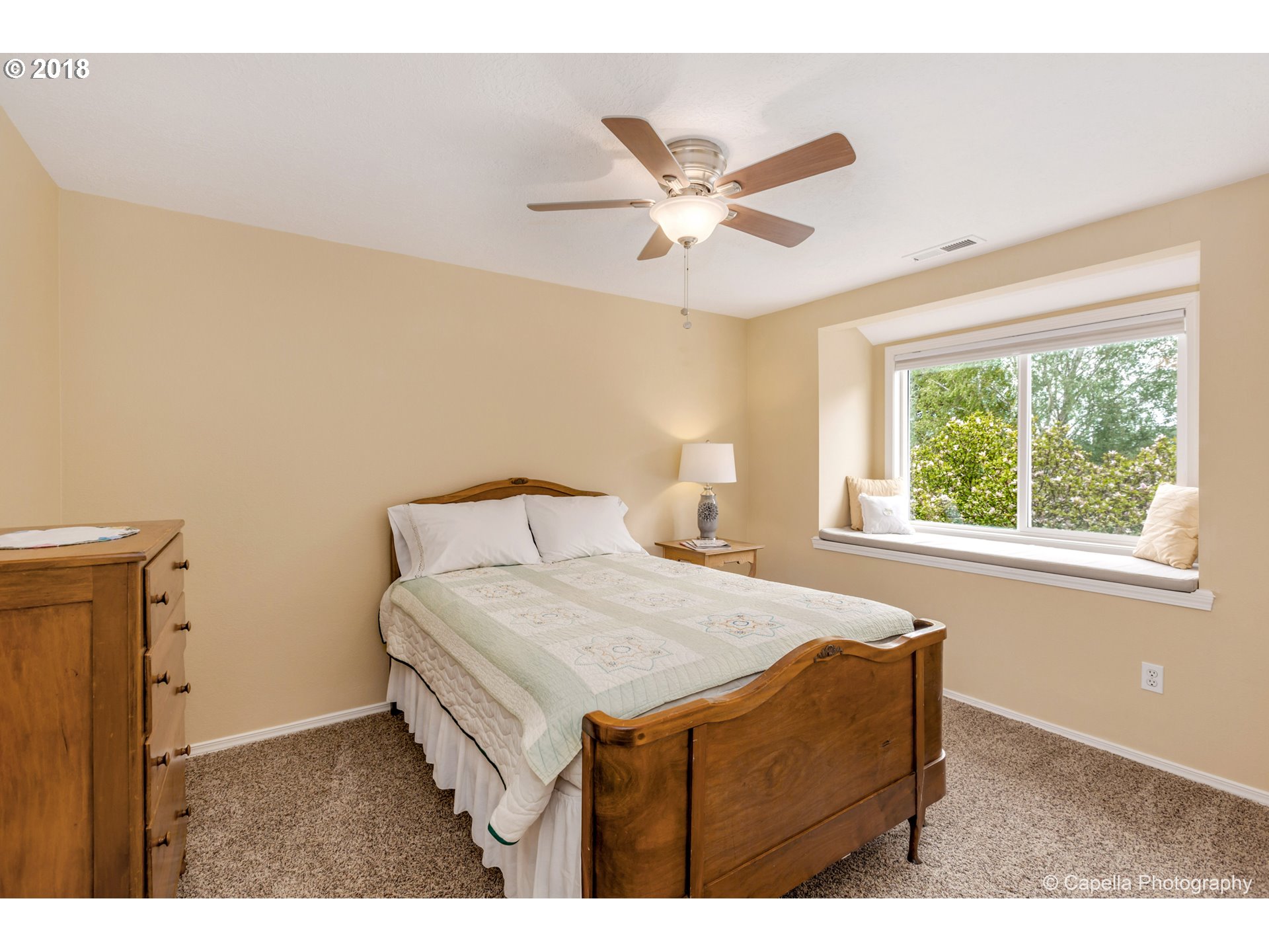 11675 Hazelgreen Road Northeast Silverton, OR 97381 - Photo 20 of 32 a bedroom with a bed and a window