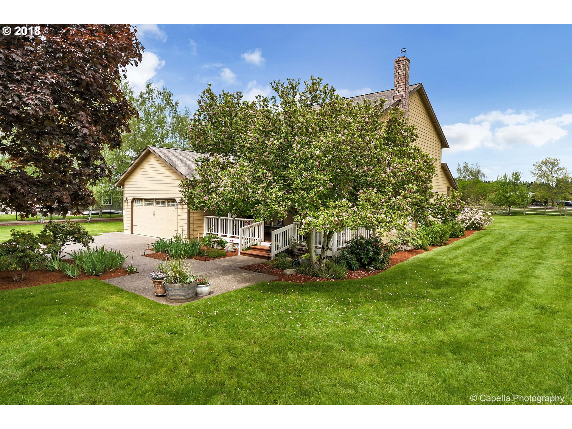 11675 Hazelgreen Road Northeast Silverton, OR 97381 - Photo 2 of 32 a view of a house with backyard and sitting area
