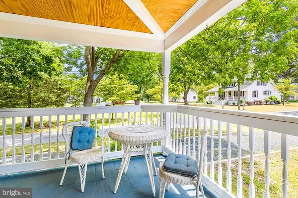 a view of a chairs and table in patio