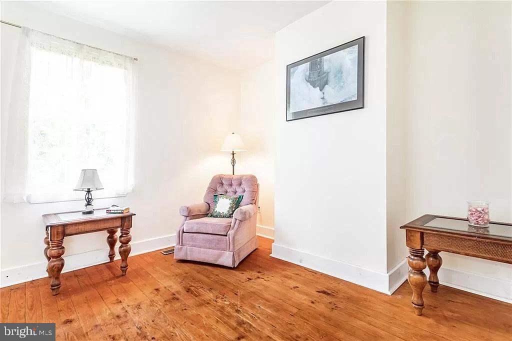 24171 Adelaide Street Parksley, VA 23421 - Photo 27 of 40 a living room with furniture and a window