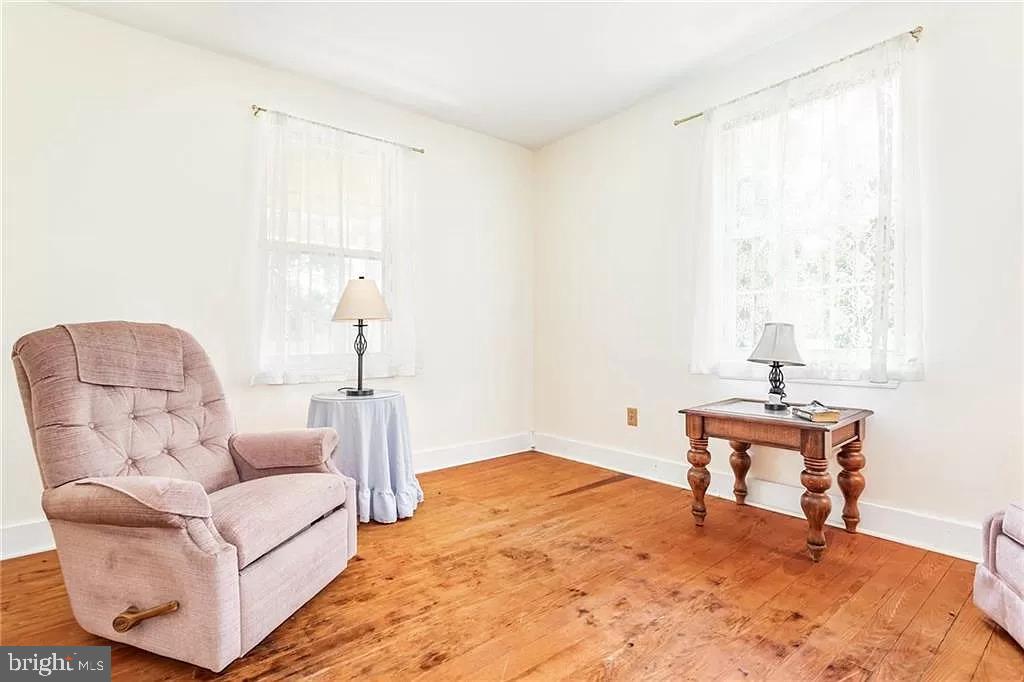24171 Adelaide Street Parksley, VA 23421 - Photo 28 of 40 a living room with furniture and a window